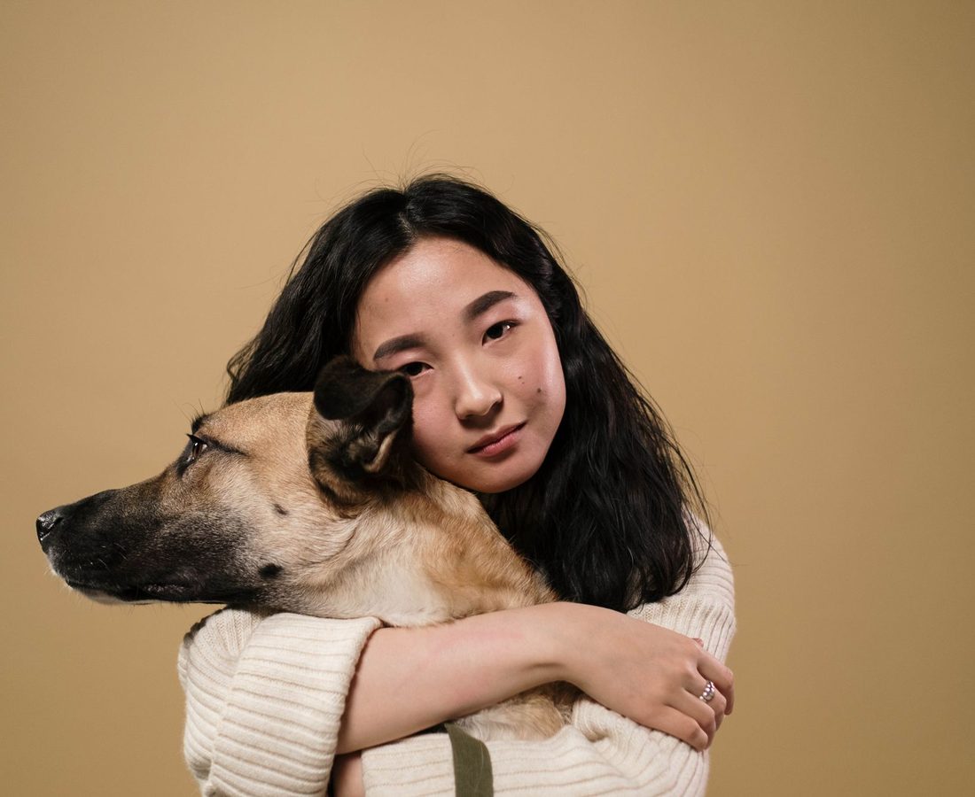 An owner reunited with their dog after an international flight