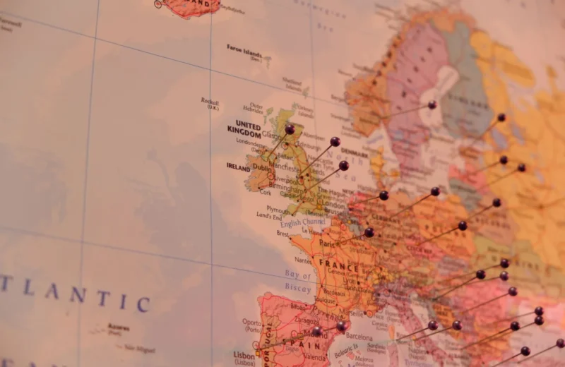 Close-up of a map with push pins marking countries in Europe, including Ireland and the UK.