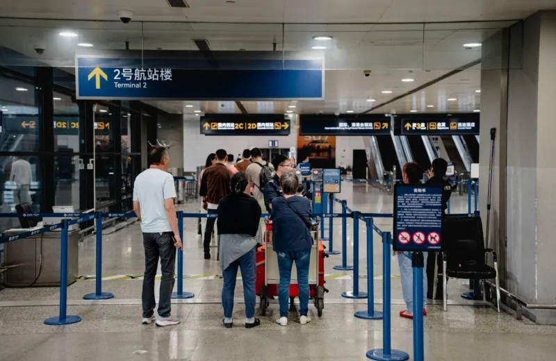 Passengers queue at Terminal 2 in Shanghai Airport, China.