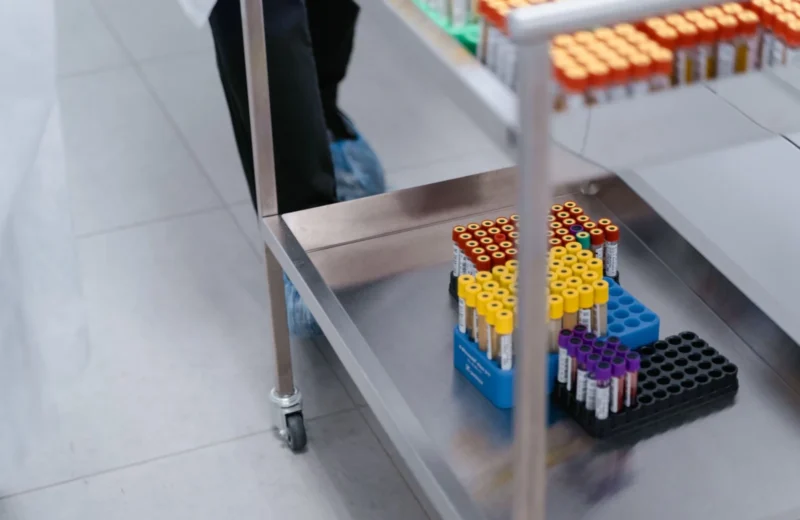 A close-up of blood sample vials organized in a laboratory setting.